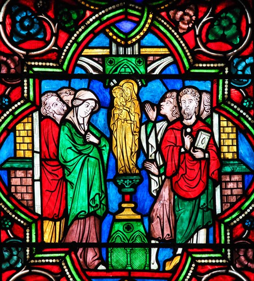 Stained Glass in Notre Dame Cathedral of Paris depicting the Adoration of the Blessed Virgin Mary