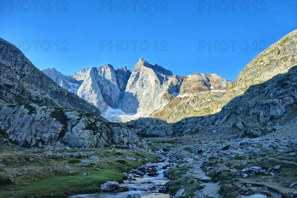 Mountain stream flowing from the Glacier des Oulettes, at the head of the Vallee de Gaube, French Pyrenees.