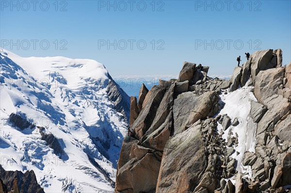 Mountaineers on summit, Chamonix, Haute Savoie, France