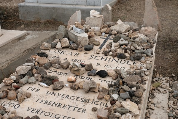 Inscription on Oskar Schindler grave in Hebrew and German reads“Oskar Schindler A righteous man among the Gentiles. The unforgettable life savor of 1200 persecuted Jews” located in the Roman Catholic Franciscan cemetery on Mount Zion Jerusalem Israel