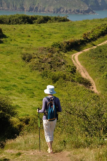 PLOUHA, FRANCE -May25 2017 : Hiker on the GR34 at Plouha