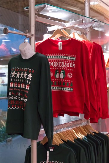 Burnaby, Canada - December 11, 2019: Colourful Christmas ugly sweaters for sale are available at Simon Fraser University bookstore