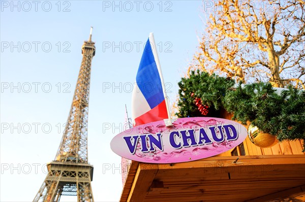 PARIS, FRANCE - DECEMBER 26, 2015: Hot mulled wine ("vin chaud" in French) for sale Christmas market near Eiffel tower.