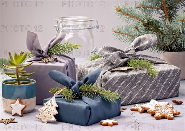 Eco Friendly Holiday Concept. Furoshiki Wrapped Cloth Gifts for Zero Waste Christmas.