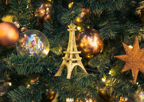 Christmas decorations with Eiffel Tower on the branches fir.