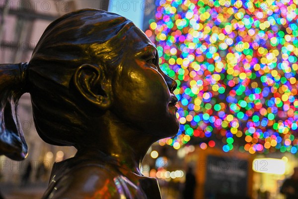 The Fearless Girl statue stands in front of the New York Stock Exchange (NYSE) on Wall Street on December 2, 2022 in New York.