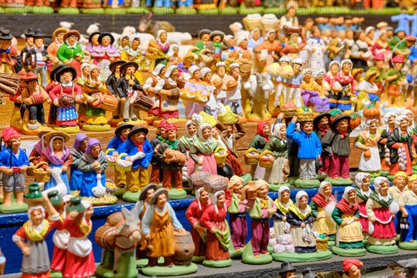 Large display of Santon figurines for sale in a market booth  at the Strasbourg Christmas Market