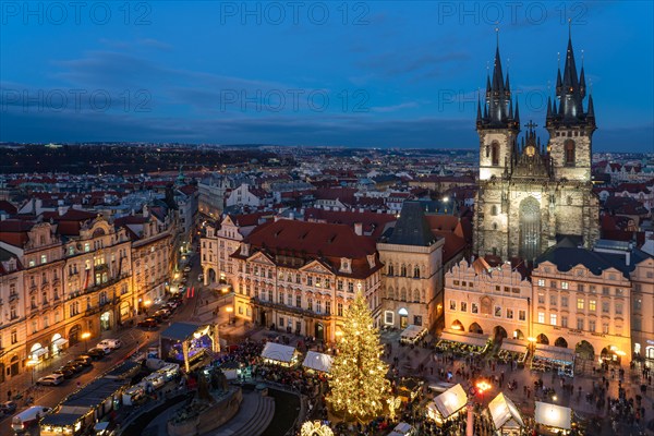 This is an evening view of the Old Town Square during the Christmas Market, a popular time to visit the city on December 08, 2022 in Prague, Czech Rep