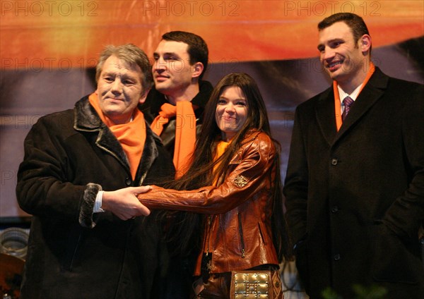 Dec 22, 2004 - Kiev, Ukraine - The Ukrainian opposition has noted month Orange Revolution. The leader of opposition VICTOR JUSHCHENKO (L), Singer RUSLANA LYZHECHKO with Ukrainian boxers, brothers VITALY KLICHKO and VLADIMIR KLICHKO. (Credit Image: © PhotoXpress/ZUMA Press) RESTRICTIONS: North and South America RIGHTS ONLY!