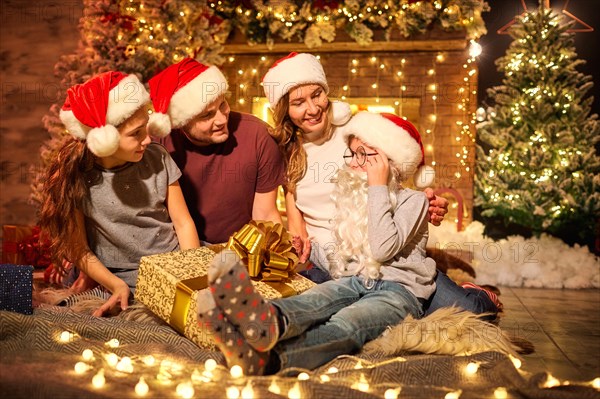 Happy family in a room  at Christmas.