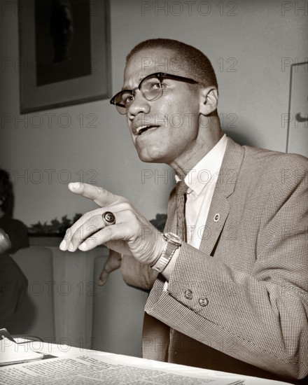 Malcolm X in Chicago, Illinois. May, 1961. Nation of Islam and Black Muslim leader. Image toned from 2.25 x 2.25 inch B&W negative.