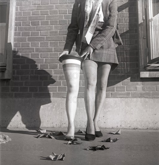 Nylon stockings in the 1950s. If you ever wondered how the shape and size of the nylon stockings was decided: Pictured here the prototype woman leg in the average size established by a measurement of 10 000 american womens legs.  The model Solveij Nyhlén pictured outside the swedish factory of nylon stockings, Malmö strumpfabrik. Established 1926 and became the leading manufacturer of silk stockings in sweden. At this time 1951 the company had invested in new machinery to make the popular nylon stockings. Ref BE19-8