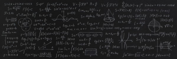 Formulas and calculations from mathematics and geometry on school blackboard