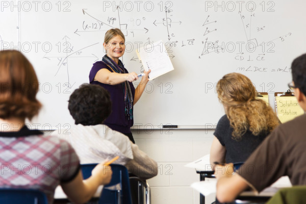 Woman teaching geometry class