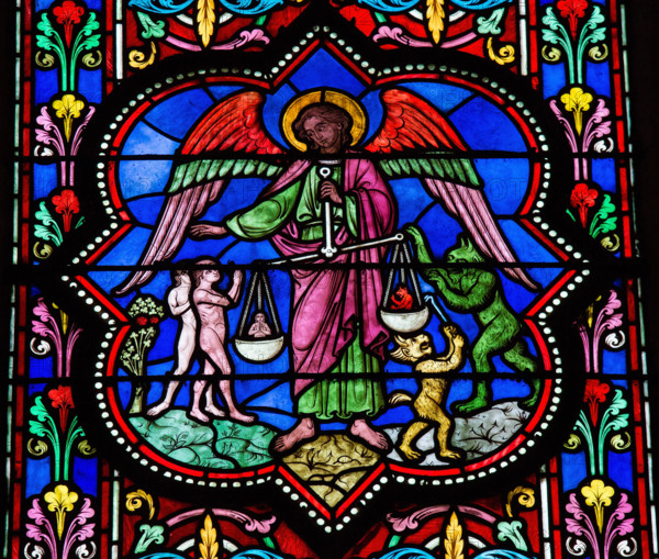 Stained glass window depicting Saint Michael the Archangel at the Final Judgement, in Bayeux, Calvados, France