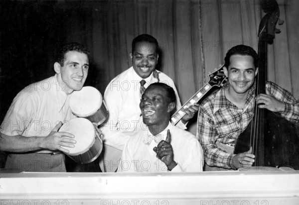 Musician Nat King Cole performing in a show