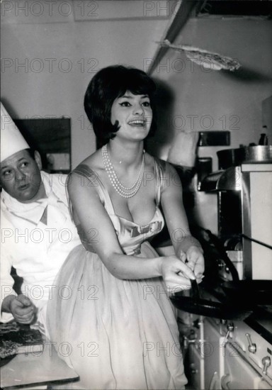 Jan. 30, 1961 - Flapjacks or Candlemas: Photo shows Franco-Italian starlet Silivia Sorente trying her hand at throwing up the pancakes while the chef looks on. (''Throwing Up'' pancakes is an old French Candlemas custom)