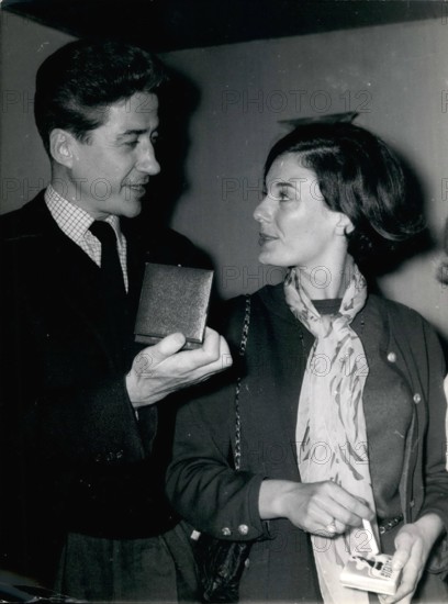 Feb. 24, 2012 - Director Alain Resnais Receives Critics' International Prize... For his latest film Director Alain Resnais received the International Prize of Critics. OPS: Alain Resnais showing his medal to Delphine Seyrig, star of the film and who received for it the first Prize in Venice.