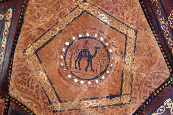 Moroccan brown leather sofa with camel.  France.