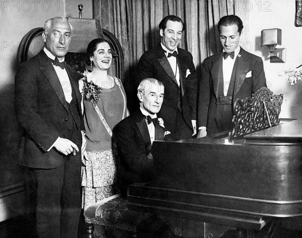 MAURICE RAVEL French composer at piano in 1928 celebrating his birthday with George Gershwin at right and Eva Gauthier