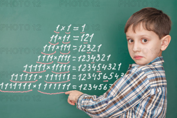 Education mathematics concept with a surprised boy