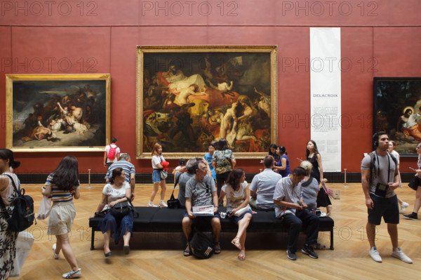 Visitors in front of the painting 'Death of Sardanapalus' (1827-1828) by French Romantic painter Eugène Delacroix displayed at his retrospective exhibition in the Louvre Museum in Paris, France. The exhibition presenting the masterpieces of the leader of French Romanticism runs till 23 July 2018.