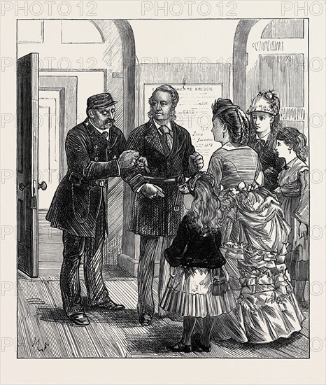 THE PRESS ROOM: TRYING ON THE PINIONING JACKET, 1873