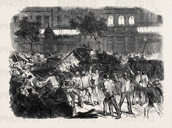 THE DISTURBANCES IN PARIS: THE MOB ATTEMPTING TO CONSTRUCT A BARRICADE ON THE BOULEVARD MONTMARTRE, OPPOSITE THE CAFE DES VARIETES, 1869, FRANCE