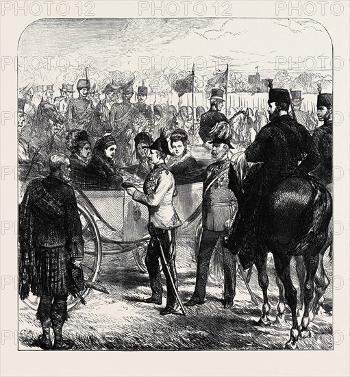 REVIEW AT WINDSOR: THE QUEEN PRESENTING THE CROSS OF ST. MICHAEL AND ST. GEORGE TO SIR GARNET WOLSELEY, 1874