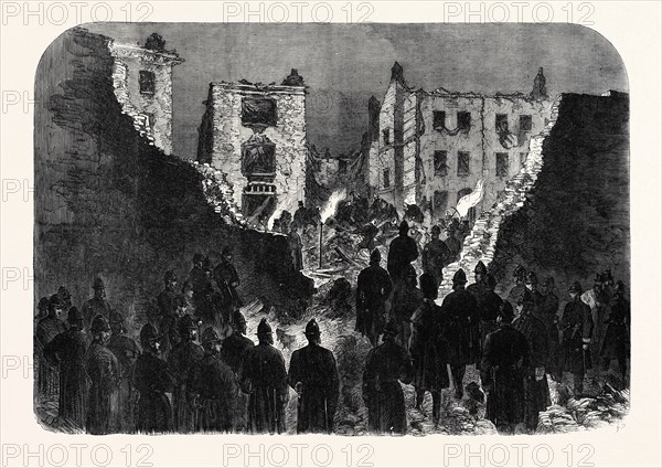 EFFECTS OF THE EXPLOSION AT THE HOUSE OF DETENTION, CLERKENWELL, SEEN FROM WITHIN THE PRISON YARD: SEARCHING THE RUINS, 1867
