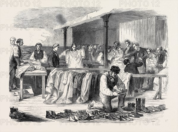 THE COTTON FAMINE: THE MANCHESTER AND SALFORD DISTRICT PROVIDENT SOCIETY DISTRIBUTING CLOTHING, 1862