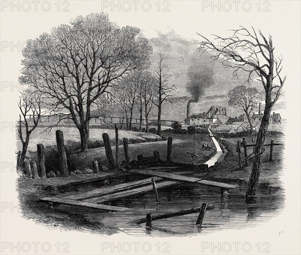 THE FATAL EXPLOSION AT ST. EDMUND'S MAIN COLLIERY, BARNSLEY: TRENCH CUT TO THE DEARNE AND THE DOVE CANAL FOR THE PURPOSE OF FLOODING THE PIT, 1862