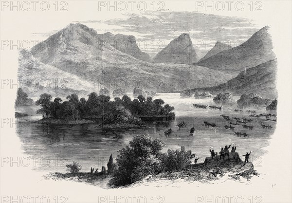 THE QUEEN'S VISIT TO IRELAND: THE ROYAL BARGE PROCEEDING THROUGH THE UPPER LAKE OF KILLARNEY TO DERRICUNIHY CASCADE, SKETCHED FROM THE KENMARE ROAD