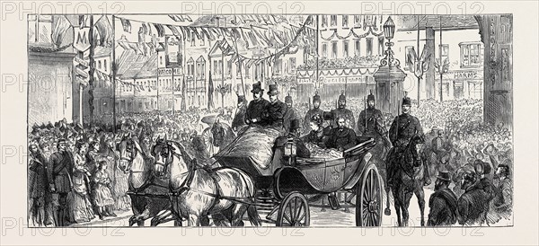 THE DUKE AND DUCHESS OF EDINBURGH AT ASHFORD: THE PROCESSION PASSING THE SARACEN'S HEAD, DECEMBER 5, 1874