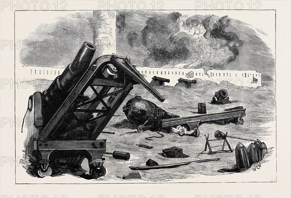 THE WAR IN EGYPT: AFTER THE BOMBARDMENT OF ALEXANDRIA: THE EFFECT OF THE SHELLS FROM H.M.S. "SUPERB" AND "INFLEXIBLE" ON THE GUNS IN FORT PHAROS