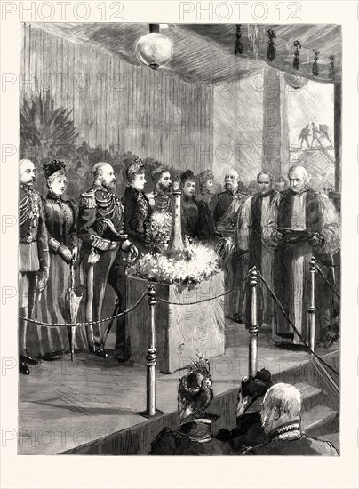 THE OPENING OF THE ROYAL NAVAL EXHIBITION BY THE PRINCE AND PRINCESS OF WALES: THE ARCHBISHOP OF CANTERBURY READING PRAYERS BEFORE HER ROYAL HIGHNESS PERFORMED THE OPENING CEREMONY