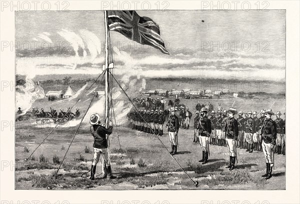 THE FIGHTING BETWEEN PORTUGUESE AND BRITISH SOUTH AFRICA CO.'S TROOPS IN SOUTH AFRICA, INCIDENTS DURING THE COMPANY'S EXPEDITION TO MASHONALAND: SALUTING THE BRITISH FLAG AT FORT SALISBURY, THE RESIDENCE OF THE ADMINISTRATOR OF MASHONALAND. It was close to Fort Salisbury that the collision between the British and the Portuguese is said to have occurred.
