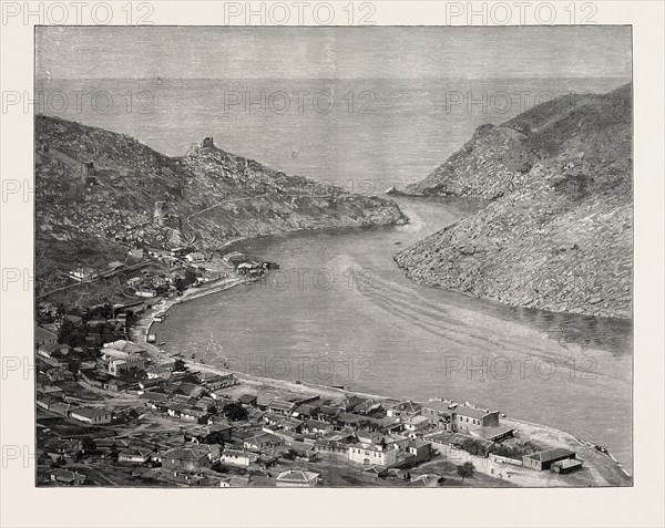 VIEW OF THE TOWN AND HARBOUR OF BALAKLAVA: The Battles round Balaclava were caused by the attempt of General Liprandia to cut the Allies off from their base at the harbour of Balaclave, and at the same time to block the road to Sebastopol. The first attack began on October 25th, and the Charges of the Light and Heavy Brigades, and the Battle of Inkermann, all rose out of this movement.