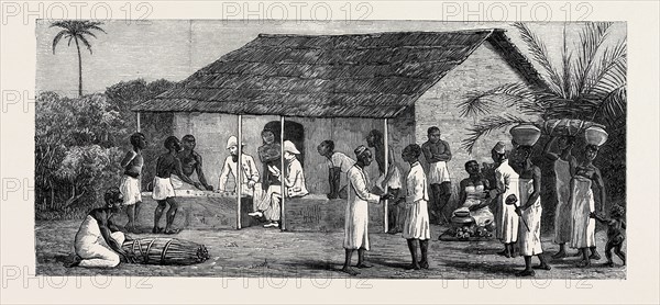 THE SLAVE TRADE ON THE EAST COAST OF AFRICA: RELEASED SLAVES ON THE UNIVERSITIES' MISSION ESTATE AT MBWENI NEAR ZANZIBAR, PAYING WAGES