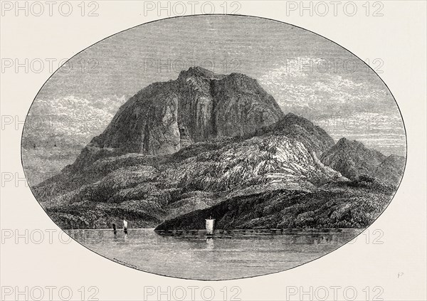 TORGHATTEN FROM THE EAST. Torghatten is a mountain on Torget island in BrÃ¸nnÃ¸y municipality in Nordland county, Norway. It is known for its characteristic hole, or natural tunnel, through its center.