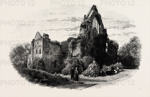 DRYBURGH ABBEY, FROM THE EAST, UK. Dryburgh Abbey, near Dryburgh on the banks of the River Tweed in the Scottish Borders, was nominally founded on 10 November (Martinmas) 1150 in an agreement between Hugh de Morville, Lord of Lauderdale and Constable of Scotland, and the Premonstratensian canons regular from Alnwick Abbey in Northumberland.