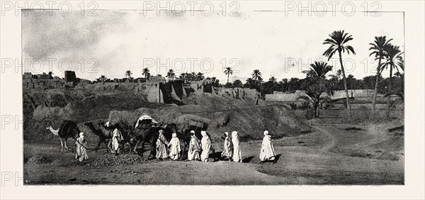 A CARAVAN APPROACHING AN OLD FORT IN BISKRA, engraving 1890