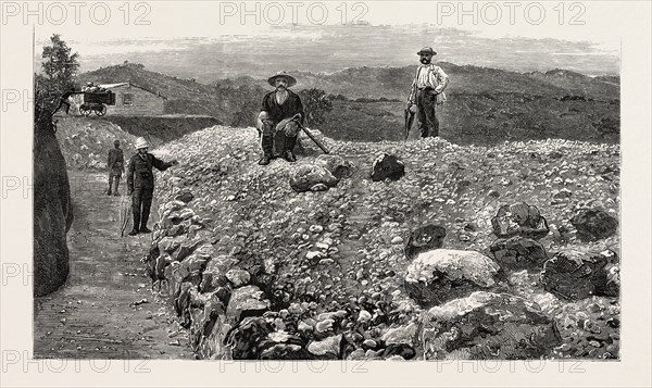 MASS OF QUARTZ EXCAVATED FROM NO. 5 TUNNEL IN THE ELIZABETH LODE, MINERS QUARTERS IN THE DISTANCE, engraving 1884, GOLD MINING IN WYNAAD, INDIA,