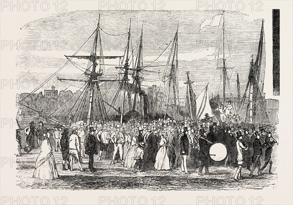 LANDING OF MESSRS. GARRATT'S WORKMEN, AT HORSEFERRY ROAD, ON THEIR VISIT TO THE GREAT EXHIBITION, LONDON, UK, 1851 engraving