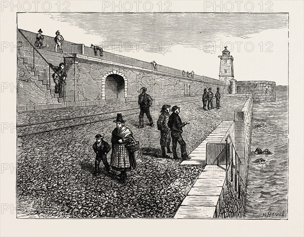 INAUGURATION OF THE HOLYHEAD BREAKWATER AND HARBOUR OF REFUGE BY H.R.H. THE PRINCE OF WALES: EXTREMITY OF BREAKWATER, AND LIGHTHOUSE, WALES, UK, 1873 engraving