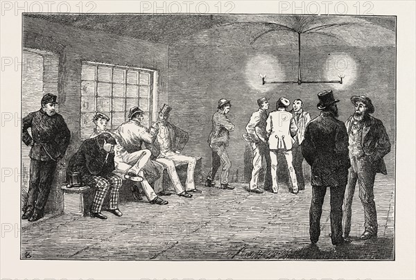 IN THE CELLARS AT NEWGATE: PRISONERS WAITING FOR THE COURT TO OPEN, LONDON, UK, 1873 engraving
