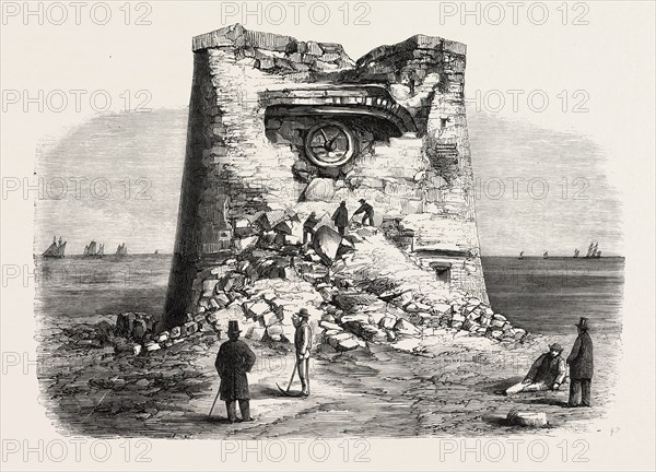 DESTRUCTION OF THE MARTELLO TOWER, EASTBOURNE, SUSSEX, BY SIR W. ARMSTRONG'S GUNS, AT A DISTANCE OF 1032 YARDS, 1860 engraving