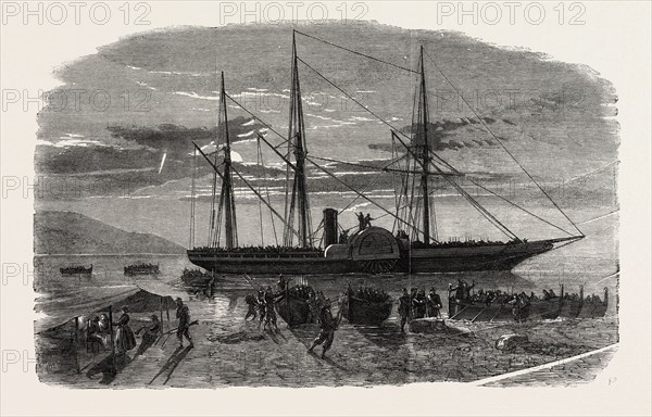 THE REVOLUTION IN SICILY: DEPARTURE OF MISSORI'S EXPEDITION ON THE NIGHT OF AUGUST 8 FROM THE FARO POINT, MESSINA, TO SURPRISE THE TORRE CAVALLO FORT, ON THE CALABRIAN SHORE, ITALY, 1860, 1860 engraving