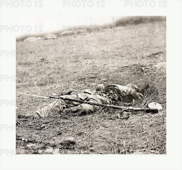 American Civil War: The horrors of war, Confederate soldier killed by a shell at the battle of Gettysburg, July 3, 1863. Photo, albumen print, By Alexander Gardner, 1821 1882, Scottish photographer who emigrated to the United States in 1856. From Gardner Photographic Art Gallery, Seventh Street, Washington