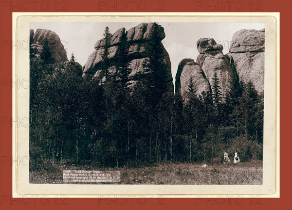 Lake Harney Peaks. Near Custer City, S.D. on B. & M. Ry, John C. H. Grabill was an american photographer. In 1886 he opened his first photographic studio